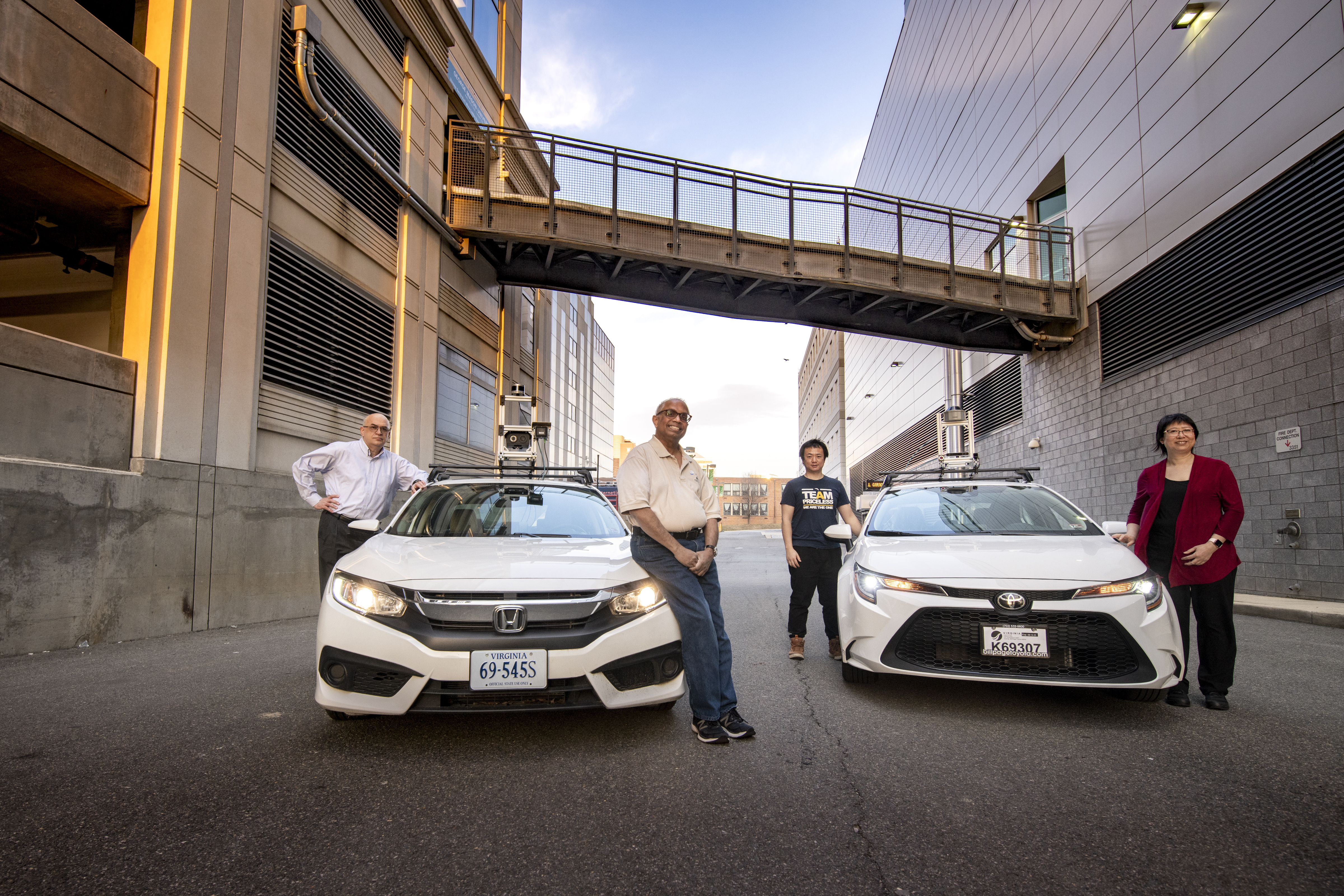 Students and faculty with autonomous car in Arlington