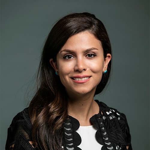 Assistant Professor Shaghayegh Bagheri in a black cardigan and white blouse