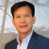 Mason associate professor Songjun Luo wears a navy-blue suit and light shirt in his profile