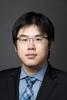 Mason assistant professor Xiang Chen wears a black suit, blue shirt and tie, and glasses in his faculty profile